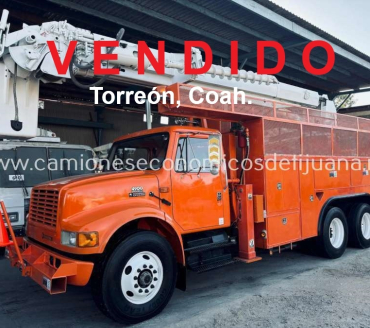 2001 INTERNATIONAL 4900 CAMION BARRENADOR CON CANASTILLA