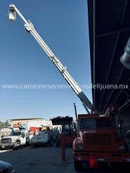 2001 INTERNATIONAL 4900 CAMION BARRENADOR CON CANASTILLA j